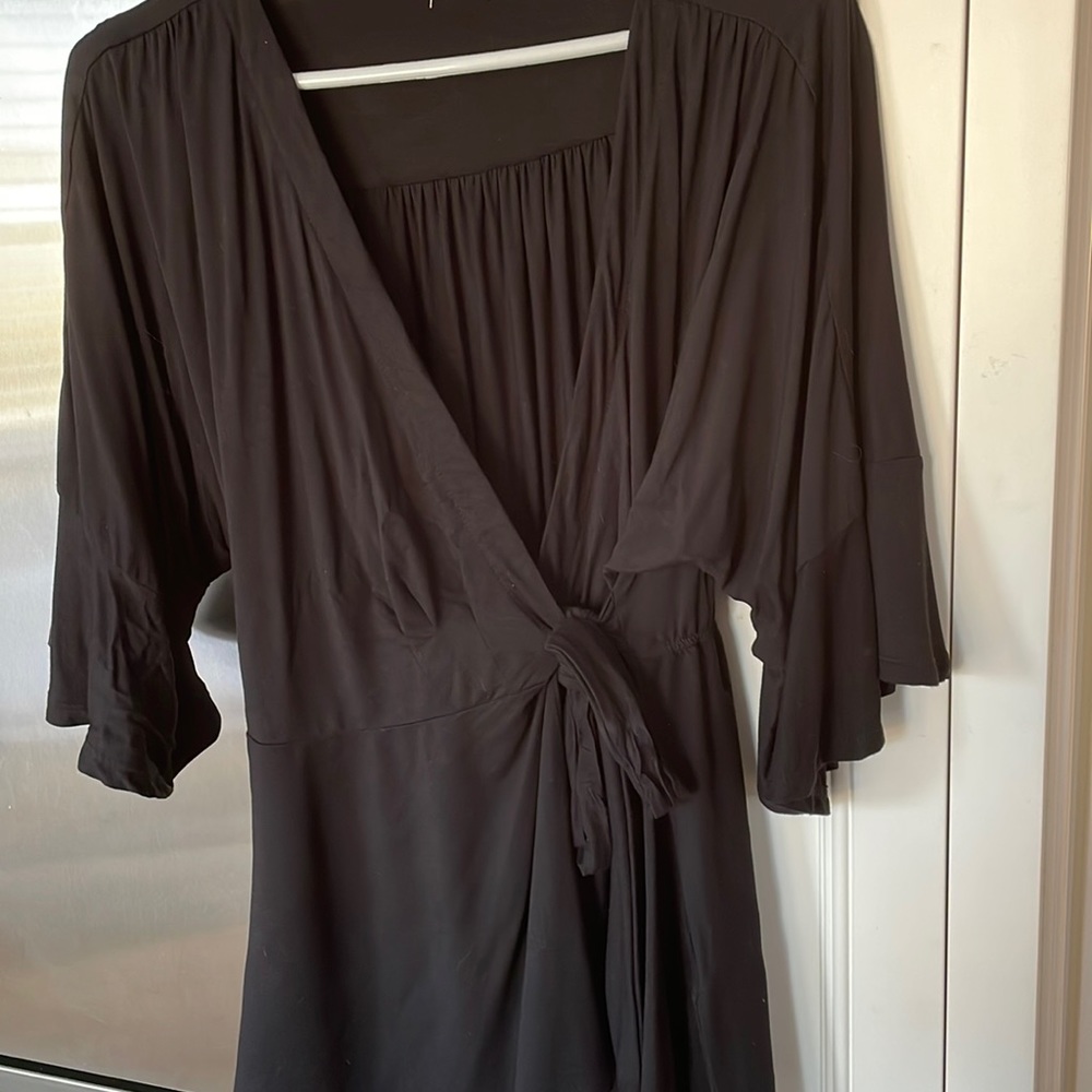 Black wrap top with bell sleeves, size small.